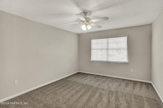 unfurnished room with ceiling fan, a textured ceiling, and carpet