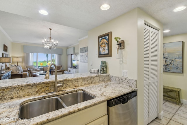 kitchen with ornamental molding, a textured ceiling, stainless steel dishwasher, and sink