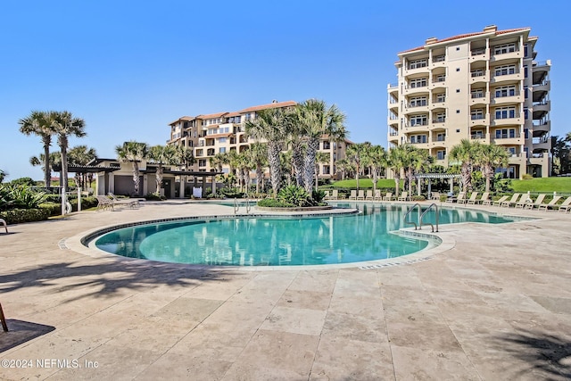 view of swimming pool featuring a patio