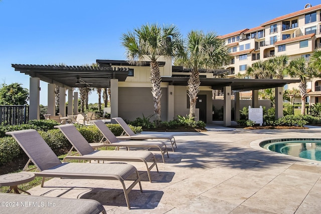 view of swimming pool featuring a pergola and a patio area