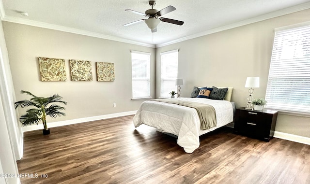 bedroom featuring ceiling fan, dark hardwood / wood-style flooring, crown molding, and a textured ceiling