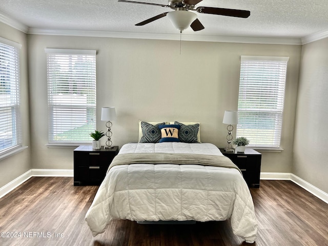 bedroom with a textured ceiling, dark hardwood / wood-style floors, and ceiling fan