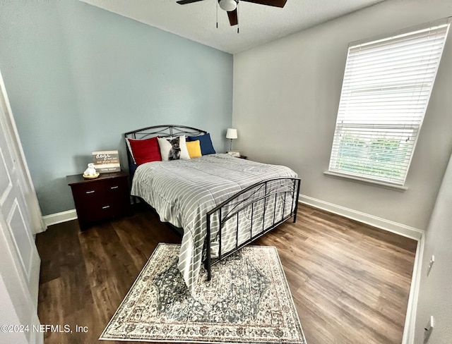 bedroom featuring ceiling fan and hardwood / wood-style flooring