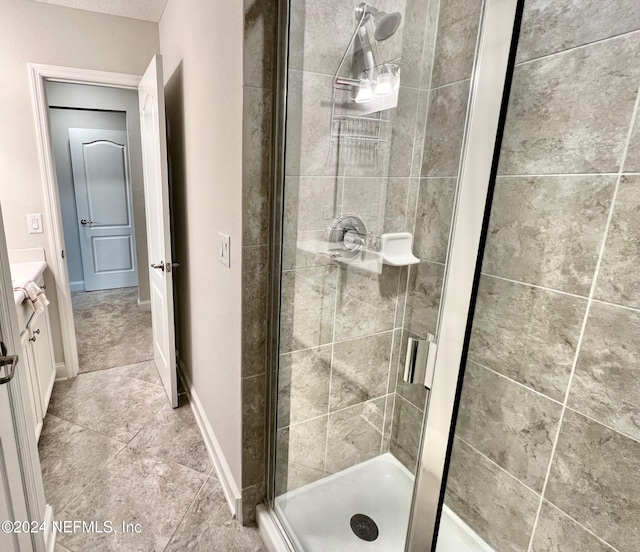 bathroom with vanity and walk in shower