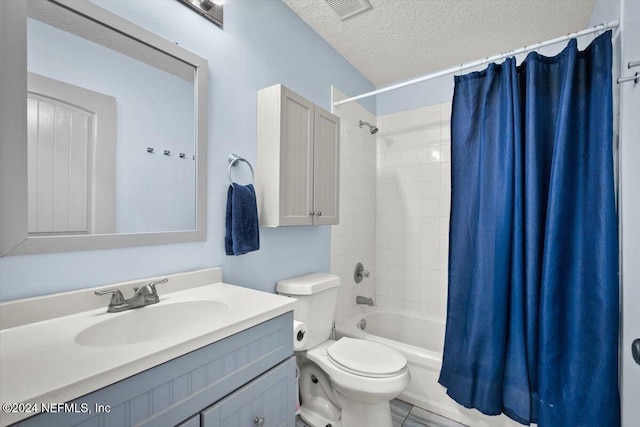 full bathroom with vanity, shower / bath combination with curtain, a textured ceiling, and toilet