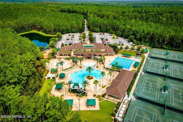 birds eye view of property with a water view