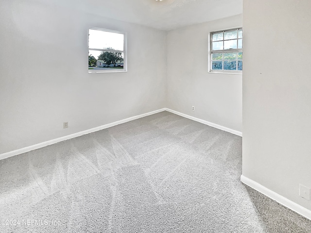 unfurnished room featuring carpet flooring