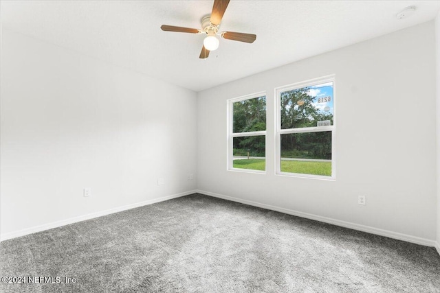 spare room with carpet flooring and ceiling fan