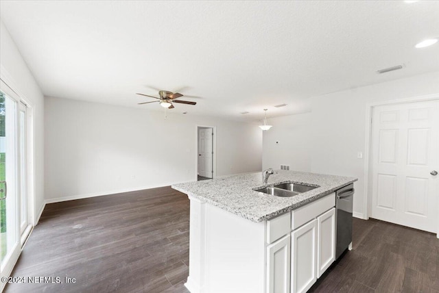 kitchen with dark wood-type flooring, white cabinetry, sink, an island with sink, and dishwasher