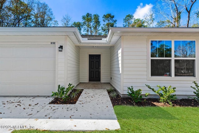 entrance to property featuring a garage