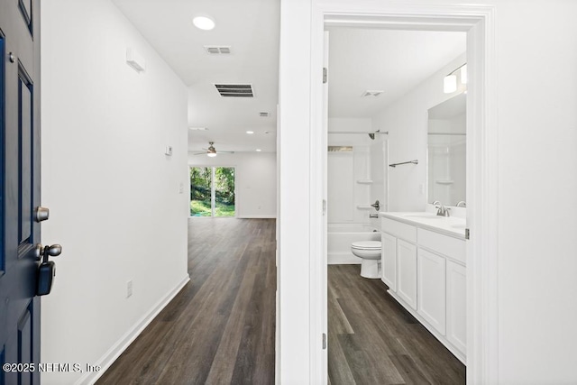 interior space featuring dark wood-type flooring and sink