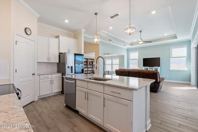 kitchen featuring plenty of natural light, sink, white cabinetry, and stainless steel appliances