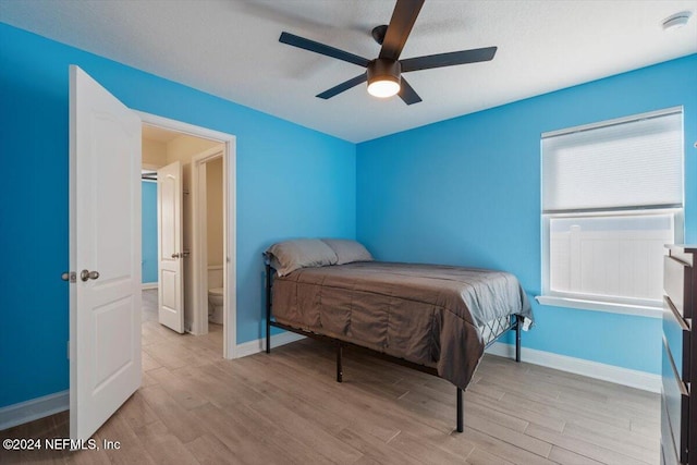 bedroom with light hardwood / wood-style flooring and ceiling fan