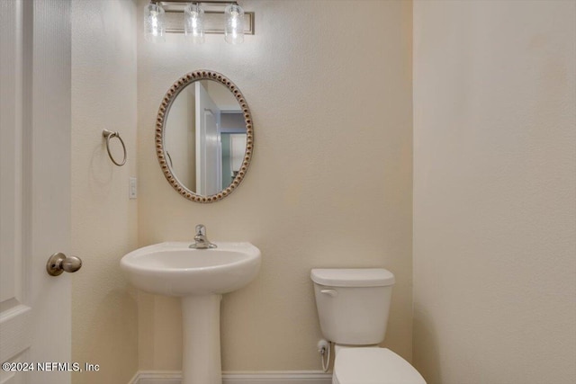 bathroom with toilet and sink