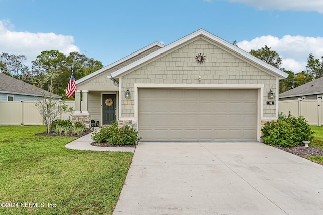 view of front facade featuring a garage and a front lawn