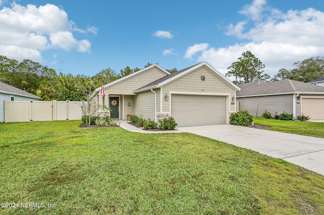 view of front of home featuring a garage and a front lawn