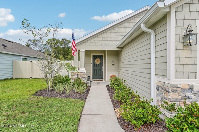 property entrance featuring a yard