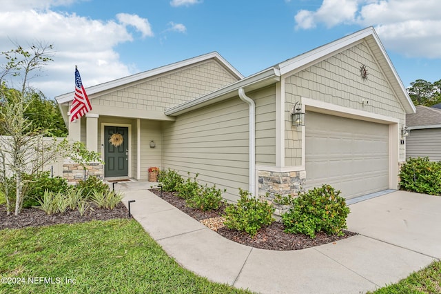 view of front of property with a garage