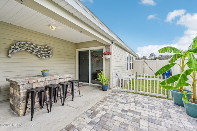 view of patio / terrace featuring an outdoor bar