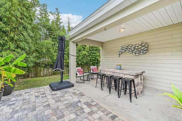 view of patio featuring exterior bar