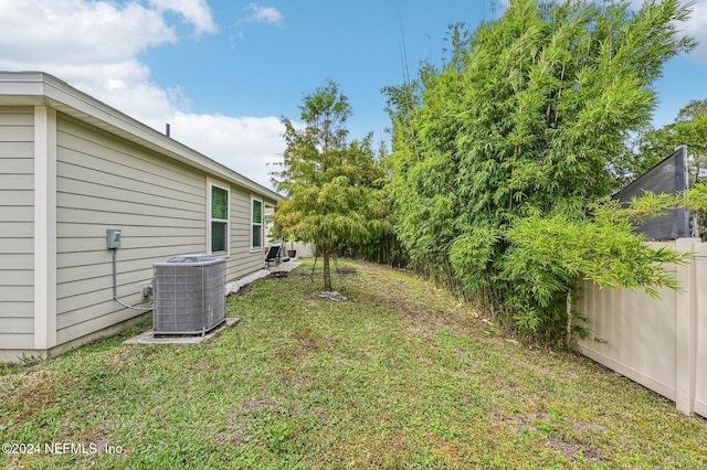 view of yard featuring central AC unit