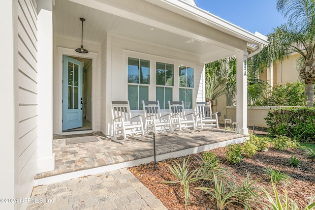 property entrance featuring covered porch