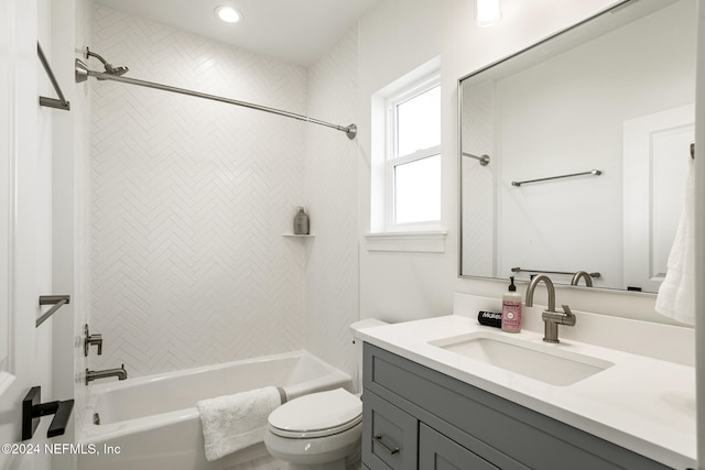 full bath featuring tub / shower combination, vanity, and toilet