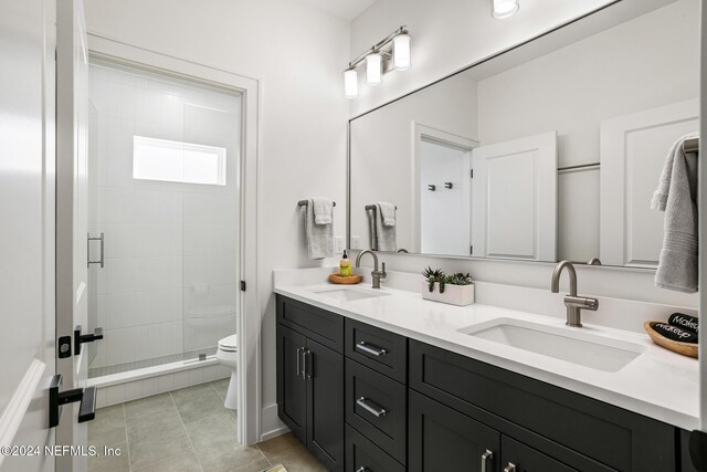 55A Solana Rd, Ponte Vedra Beach, FL 32082 - full bathroom with double vanity, a stall shower, and tile patterned floors