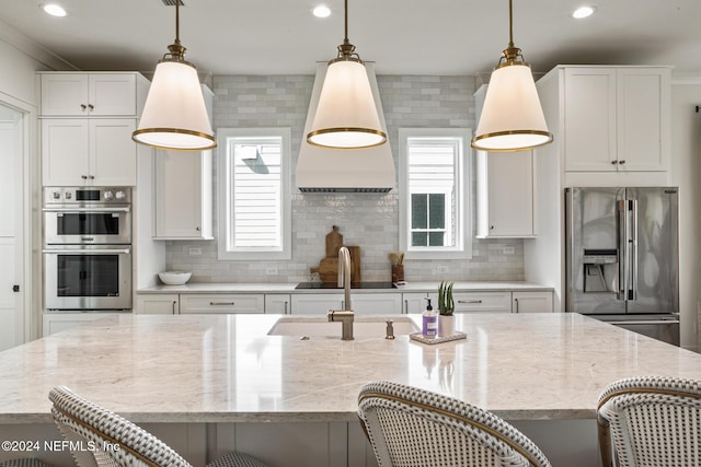 55A Solana Rd, Ponte Vedra Beach, FL 32082 - kitchen featuring stainless steel appliances, a breakfast bar, recessed lighting, and tasteful backsplash