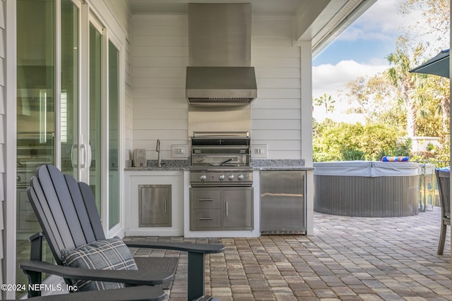 view of patio with exterior kitchen and area for grilling