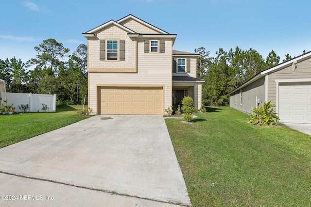 view of front of property featuring a garage and a front lawn