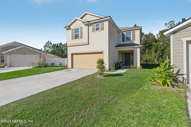 view of front of home with a front yard and a garage