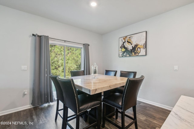 dining room featuring dark hardwood / wood-style flooring