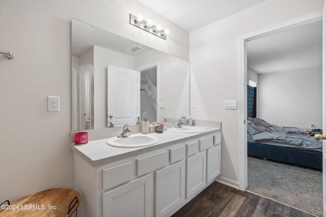 bathroom featuring hardwood / wood-style floors and vanity