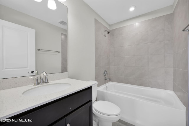 bathroom featuring visible vents,  shower combination, vanity, and toilet