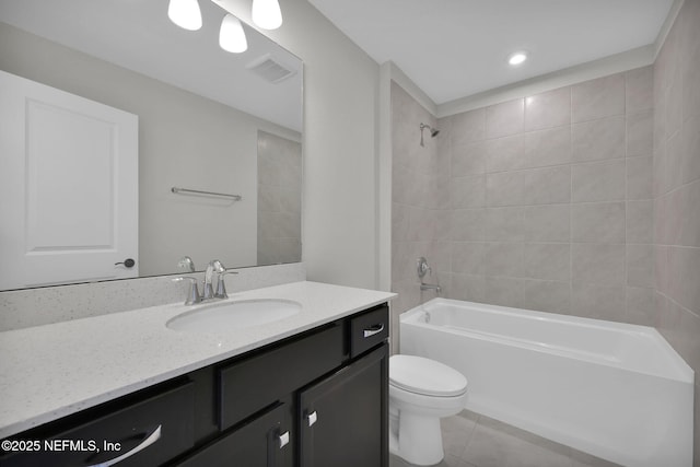 bathroom with tile patterned flooring, toilet, bathing tub / shower combination, vanity, and visible vents