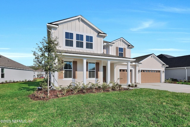 modern inspired farmhouse with a front lawn, board and batten siding, and concrete driveway