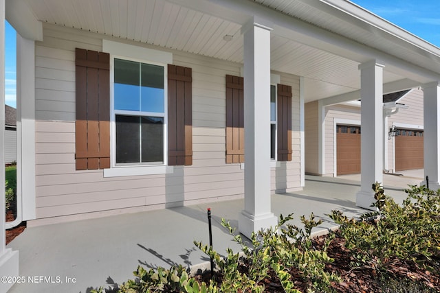 view of home's exterior featuring covered porch and an attached garage