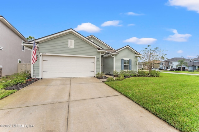 view of front of house with a garage and a front yard