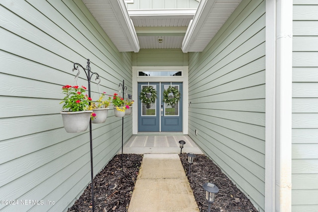 property entrance featuring french doors