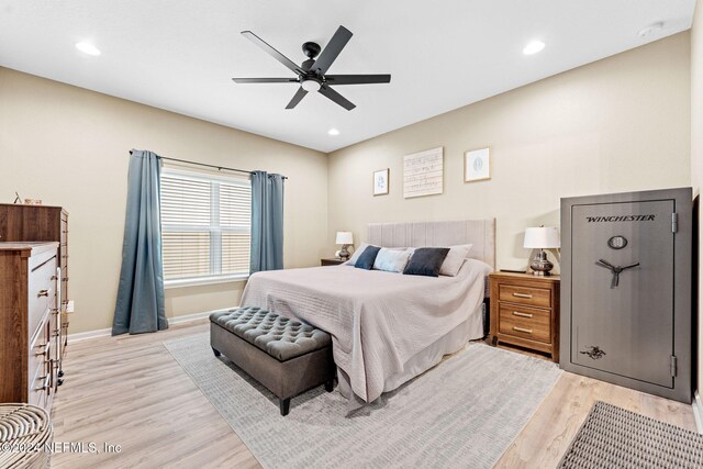 bedroom with light wood-type flooring and ceiling fan