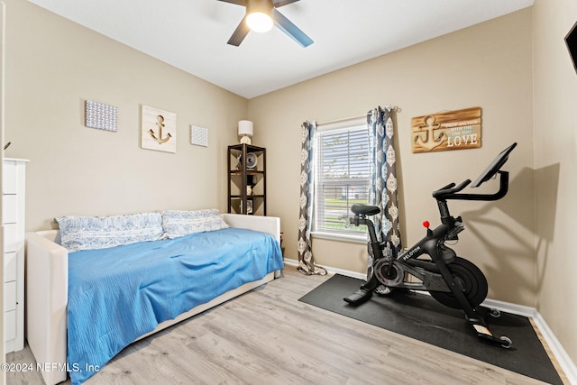 bedroom featuring light hardwood / wood-style floors and ceiling fan