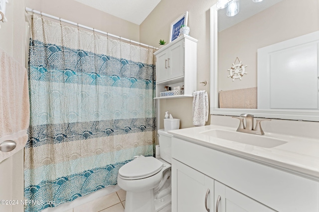 bathroom with vanity, tile patterned flooring, and toilet