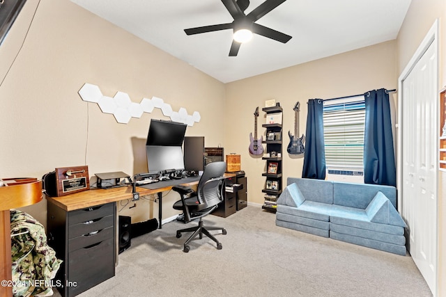 carpeted home office with ceiling fan