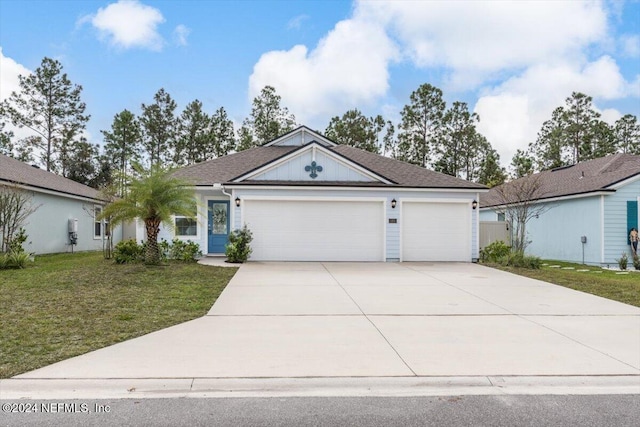 ranch-style home with a front yard and a garage