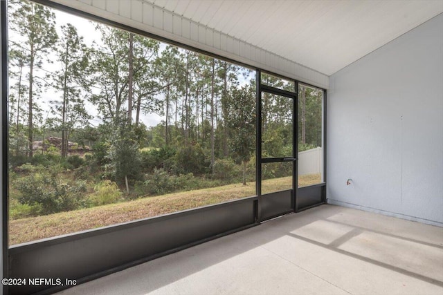 unfurnished sunroom with lofted ceiling