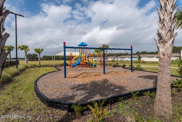 view of playground featuring a lawn