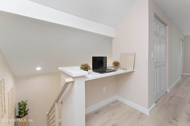 corridor featuring light hardwood / wood-style flooring