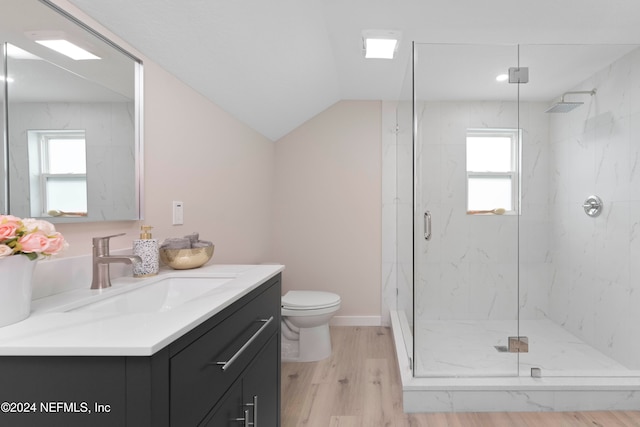 bathroom featuring hardwood / wood-style flooring, an enclosed shower, lofted ceiling, and a healthy amount of sunlight