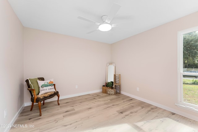 sitting room featuring light hardwood / wood-style floors and ceiling fan